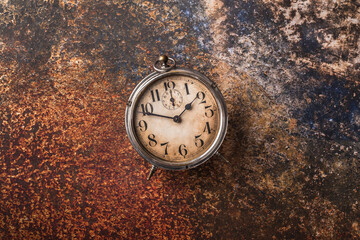 Old clock overhead rustic arrangement on vibrant color background