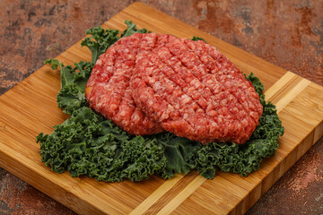 Raw beef burger cutlet for cooking