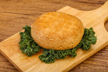 Smoked Georgian suluguni cheese piece