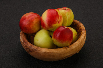 Sweet small nectarines in the basket