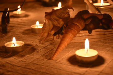 seashells and romantic candles on the table