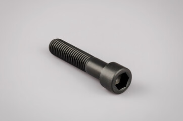 Mounting bolt under the hexagon on a gray background. Car mounting bolt. Mounting element .New...