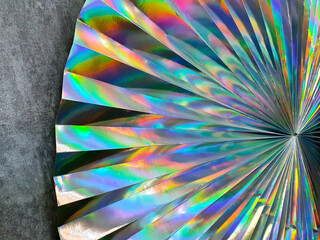 Round fan made of paper chameleon. Handmade paper texture background. DIY