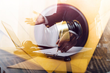 justice and law concept.Male judge in a courtroom on wooden table and Counselor or Male lawyer...