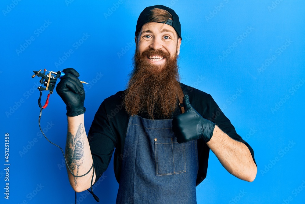 Sticker redhead man with long beard tattoo artist wearing professional uniform and gloves doing happy thumbs