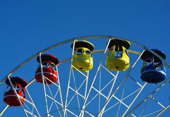 Dzień dziecka karuzela Children's Day, colorful carousel against the blue sky, Ferris wheel against the blue sky, Children's Day