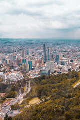 Fototapeta na wymiar Visitors take in breathtaking views of Bogota on a spring day in Mount Monserrate. Colombia, skyscrapers