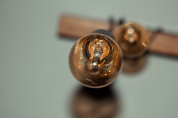 close up of vintage bulb. wooden light