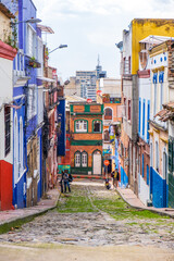 Fototapeta na wymiar Colourful buildings in the streets of La Candelaria neighborhood in Bogota, Colombia
