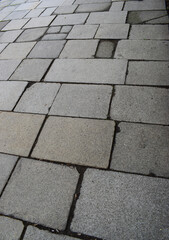 Grey stone paving, portrait oriented slant perspective view