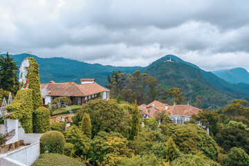 Visitors take in breathtaking views of Bogota on a spring day in Mount Monserrate. Colombia, skyscrapers