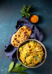 Pakistani and Indian chicken Biryani rice with mint and naa bread