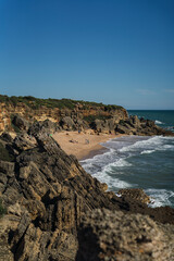 Fototapeta na wymiar Paisaje maritimo con playas en el sur de españa con acantilados y rocas