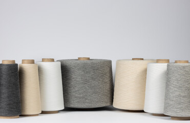 Large vintage spools with cotton thread on white isolated background