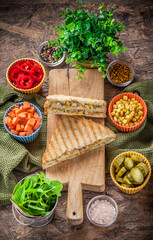 Vegan sandwiches ready to eat restaurant colorful close-up overhead arrangement with ingredients on rustic kitchen wooden table