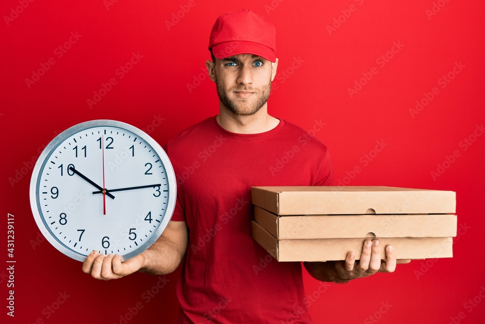 Sticker young caucasian man holding delivery package and clock skeptic and nervous, frowning upset because o