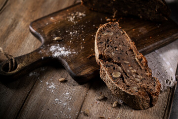 Black rye bread on a rustic table