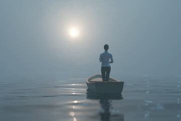 woman sailing in a boat in the fog  © Photobank
