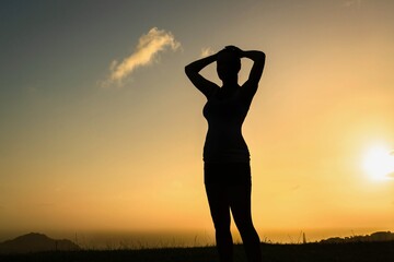 Happy people in nature. A woman watching the sunset.