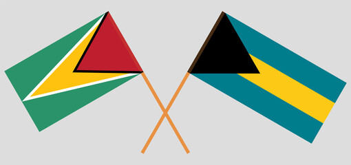 Crossed flags of Guyana and the Bahamas. Official colors. Correct proportion