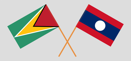 Crossed flags of Guyana and Laos. Official colors. Correct proportion