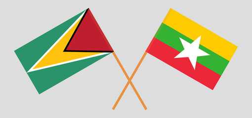 Crossed flags of Guyana and Myanmar. Official colors. Correct proportion
