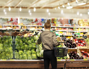 Woman buying fruits and vegetables  at the market