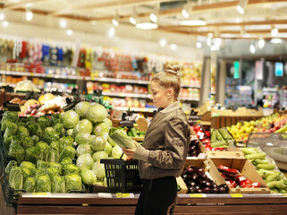 Woman buying fruits and vegetables  at the market