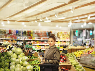Woman buying fruits and vegetables  at the market