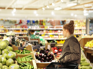 Woman buying fruits and vegetables  at the market