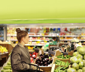 Woman buying fruits and vegetables  at the market