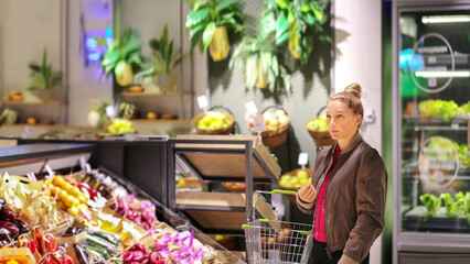 Woman buying fruits and vegetables  at the market