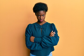 Young african american girl wearing casual clothes skeptic and nervous, disapproving expression on...