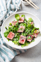 Japanese sliced grilled tuna steak salad with sesame and suace. Close up