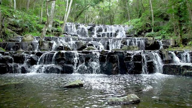 Beautiful waterfall in tropical forest at Namtok Samlan National Park, Saraburi, Thailand - Slow Motion