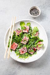 Japanese sliced grilled tuna steak salad with sesame and suace. Close up
