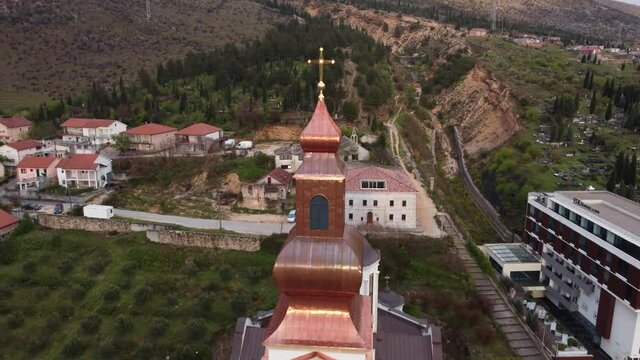 Aerial drone view of Orthodox church. Old church and bell tower during the restoration. Mostar, Bosnia and Herzegovina.