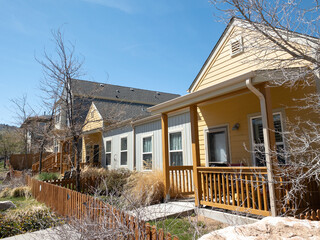 Regular street scene without people in a housing area with multiple units including condo or...