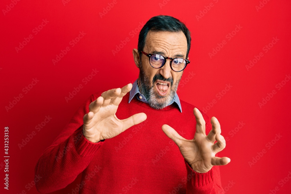 Poster Middle age hispanic man wearing casual clothes and glasses afraid and terrified with fear expression stop gesture with hands, shouting in shock. panic concept.