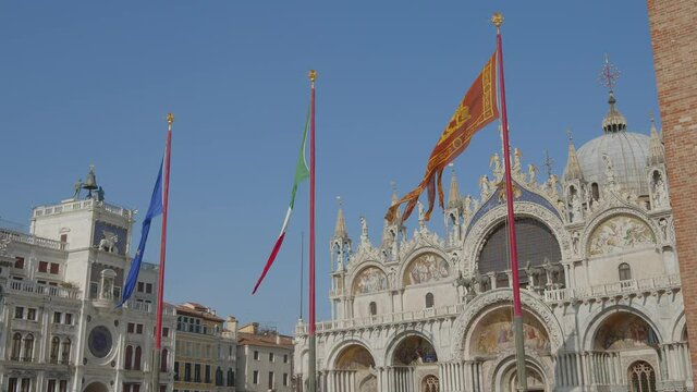 Slide left Flags in St. Mark's square, Venice, Italy. (Venezia, Italia) 4k