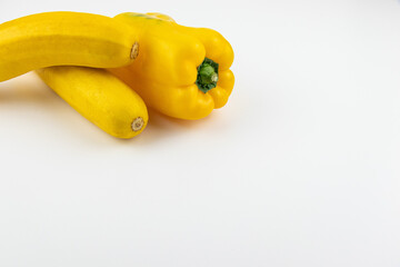 zucchini and yellow paprika on cutting board
