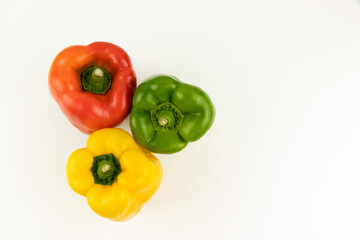 red, yellow and green paprika with white background