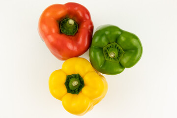 red, yellow and green paprika with white background