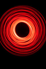 Wonderful and abstract round and parabolic patterns draw different light paths with LED ball lights on a dark background, pendulum.
