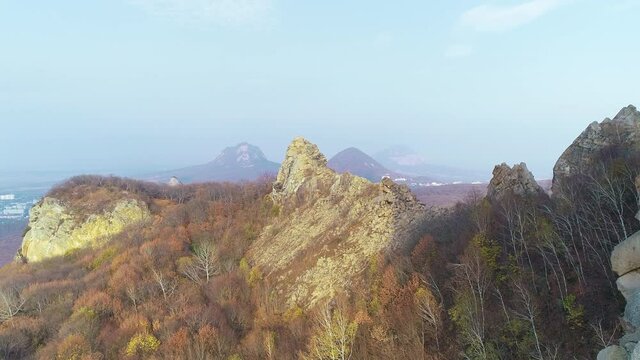 Fly over highlands and rocks on a sunny day