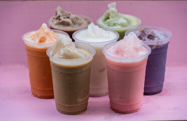Healthy drinks, milk shakes with coffee mix, chocolate latte, green tea,  tea, multicolored with pink backdrop. 