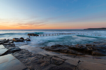 Fototapeta na wymiar Sunrise view of rock pool, Maroubra, Australia.