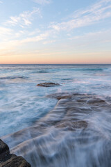 High tide ocean water flowing into the shore.