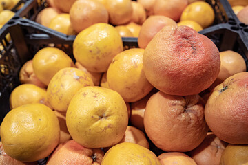 Close up of oranges in boxes in a supermarket.