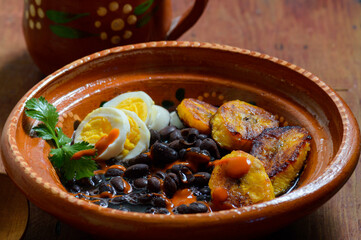 Traditional Mexican and Central American breakfast. Black beans and plantain
